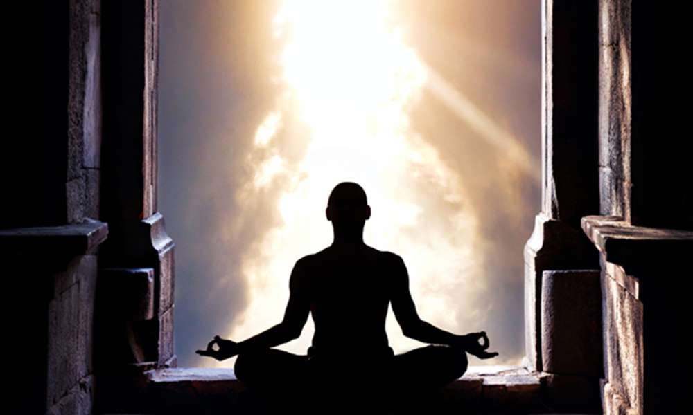What is enlightenment? The picture is depicting a Yogi in meditation.