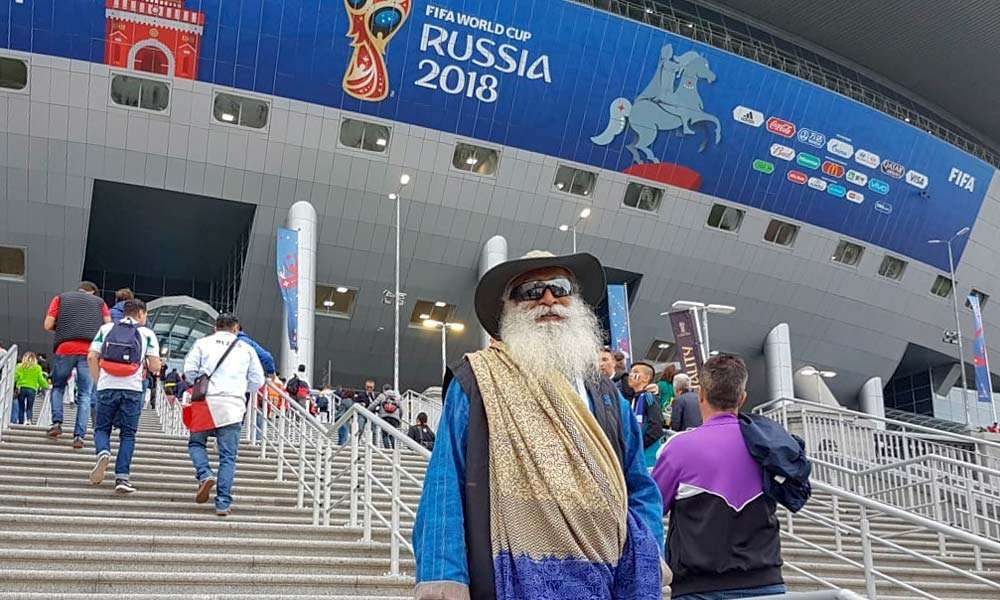 Sadhguru standing before the entrance to the St. Petersburg stadium, Russia to watch the FIFA World Cup 2018 semi-final between France and Belgium | Peak Intensity at the FIFA World Cup 2018