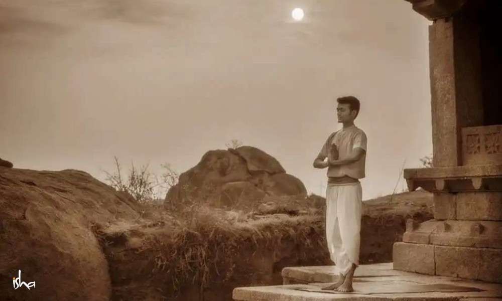 Young Indian girl doing Yoga . Surya Namaskar with mountain