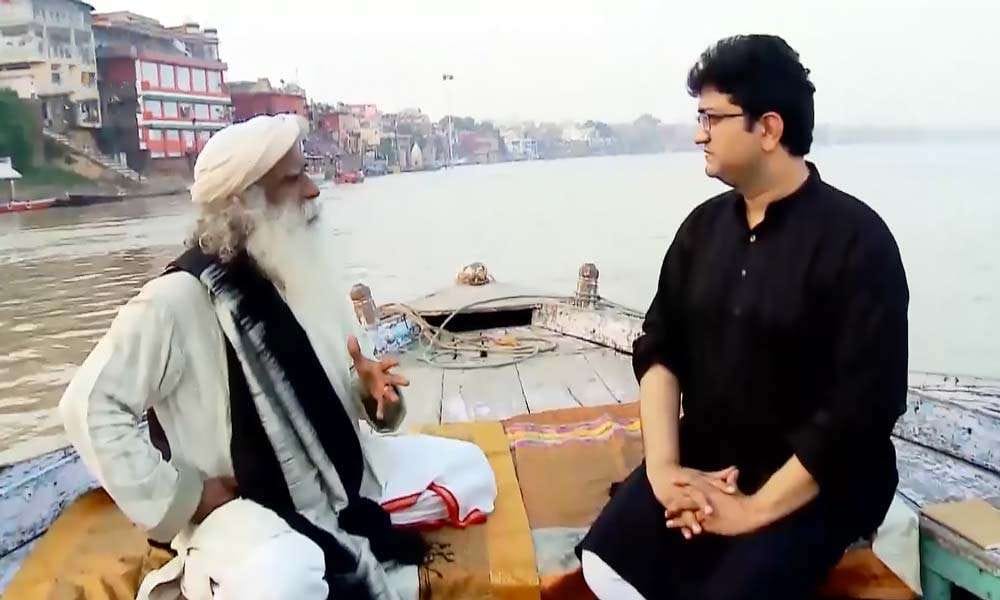 Sadhguru and Prasoon Joshi on a boat in the river Ganga at Kashi