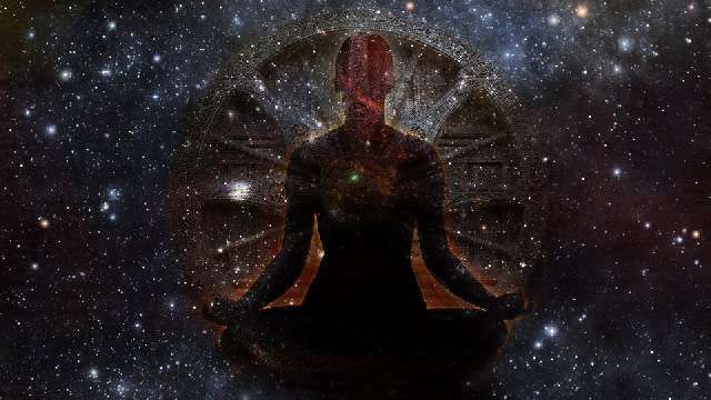 Kali Yuga explanation - A yogi sitting in meditation with the cosmos as a background