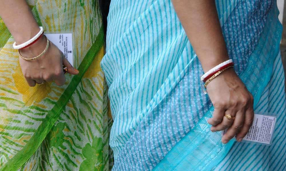 Women in queue holding their voter id's | Whom to Vote for in 2019? - Sadhguru Speaks