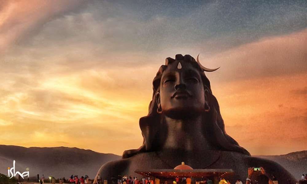 Image of 112 ft Adiyogi statue at the Isha Yoga Center taken during sunset | Why is the Adiyogi So Huge? 