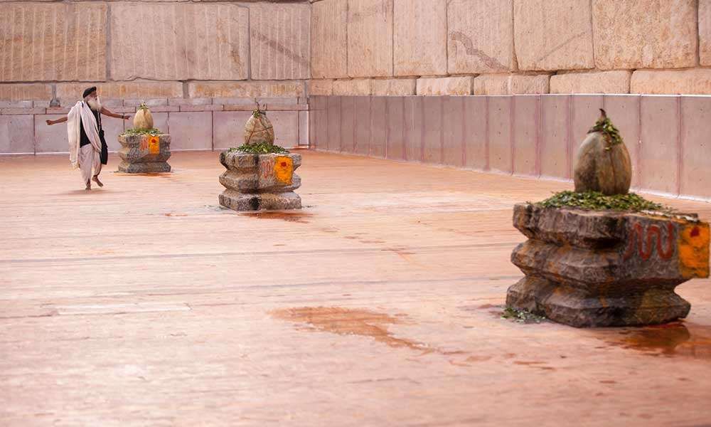 Suryakund consecration, all three lingas are visible and Sadhguru with hands stretched out.