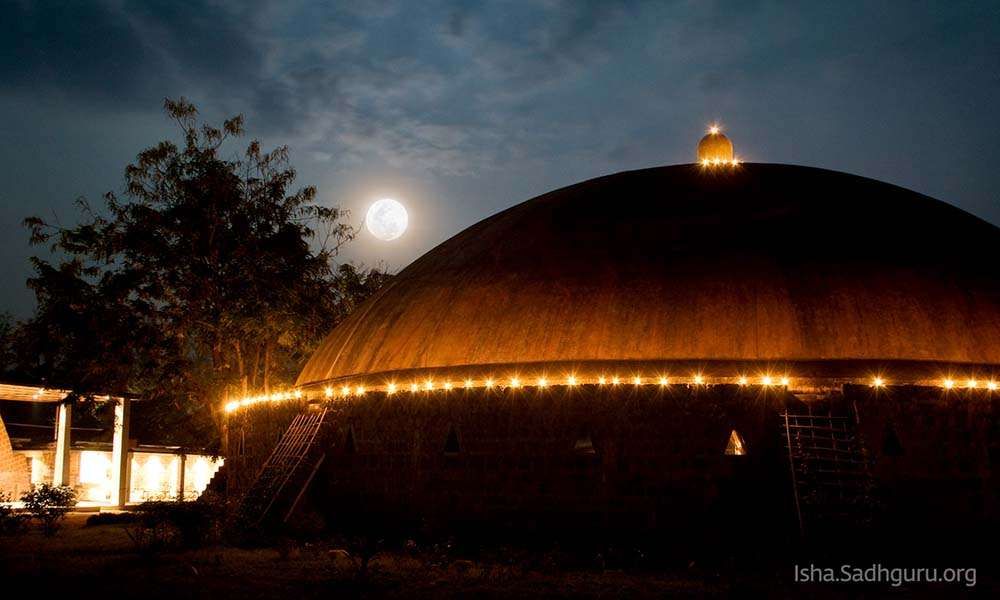 Dhyanalinga temple Dome at Isha Yoga Center Coimbatore, showing the full moon in the background.
