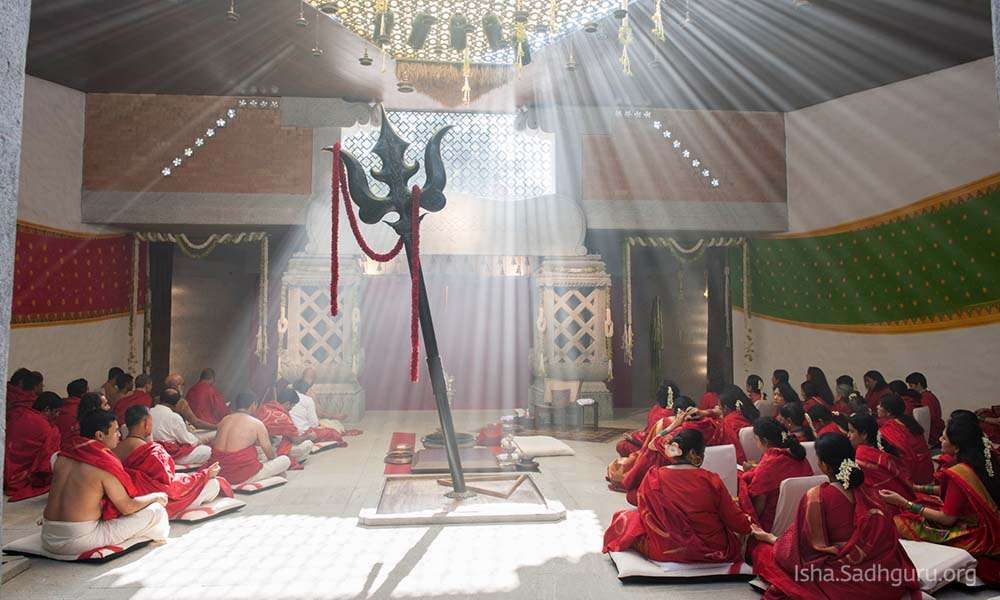 Devotees meditating inside Linga Bhairavi temple at Isha Yoga Center Coimbatore.