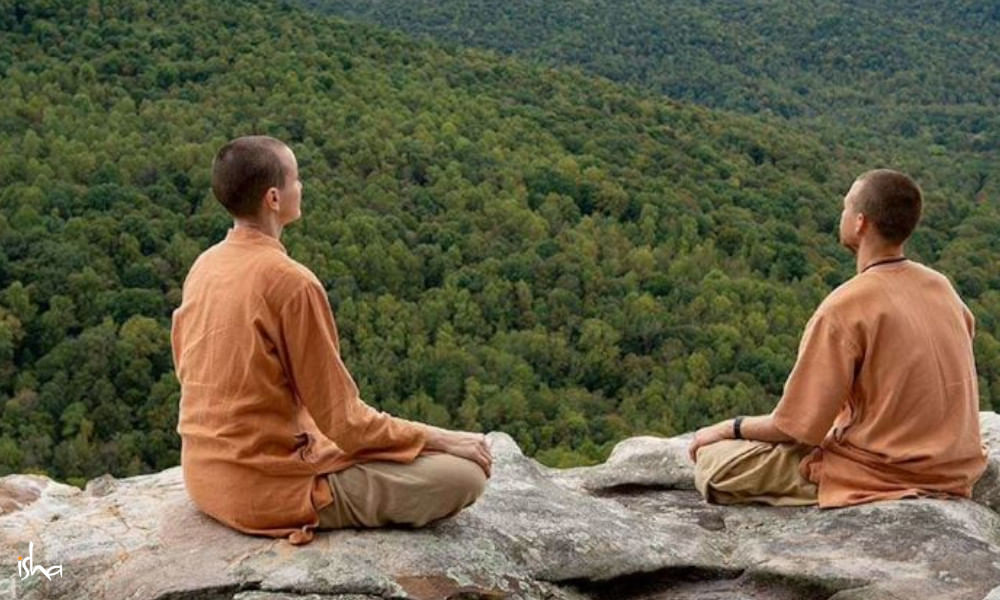 Two Isha Brahmacharis sitting in meditation