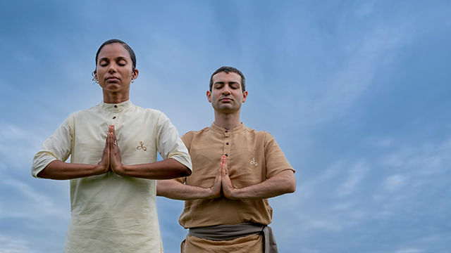 Two Isha meditators doing Namaskar