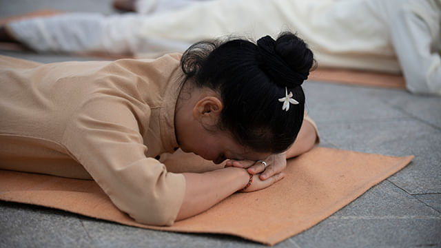 A meditator doing makarasana