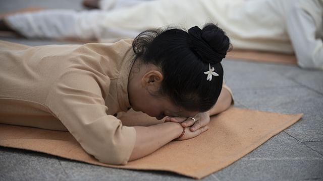 A meditator doing makarasana