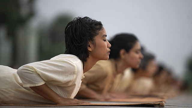 Meditators doing bhujangasana