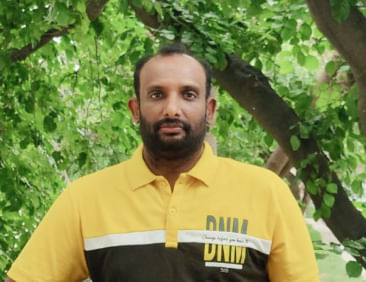 Profile picture of a person standing outdoors