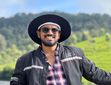 Profile picture of a person standing outdoors