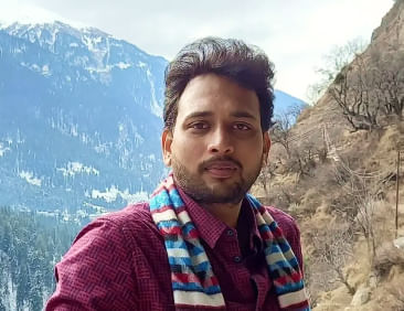 Profile picture of a person standing outdoors