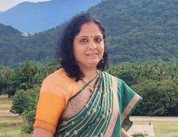 Profile picture of a person standing outdoors
